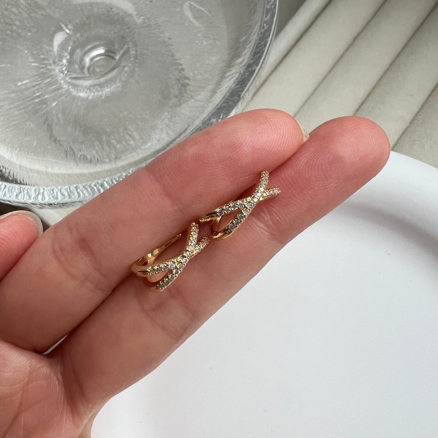 Gold ring on a finger with a blurred background
