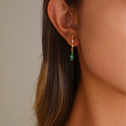 Close-up of model styling the emerald green clips, showing the secure and elegant fit.