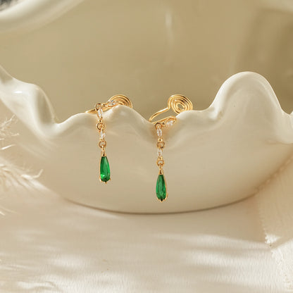 May birthstone emerald green teardrop clip-on earrings in 18k gold.