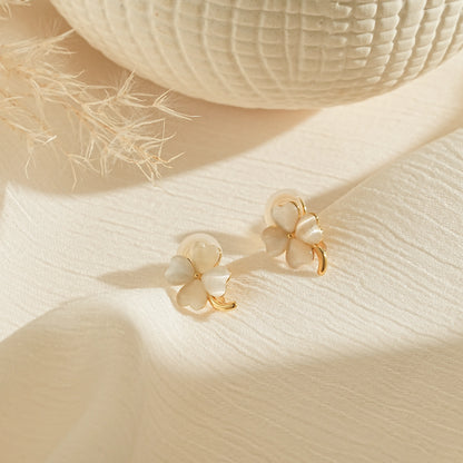 June birthstone four leaf clover moonstone clip-on earrings in 18k gold.