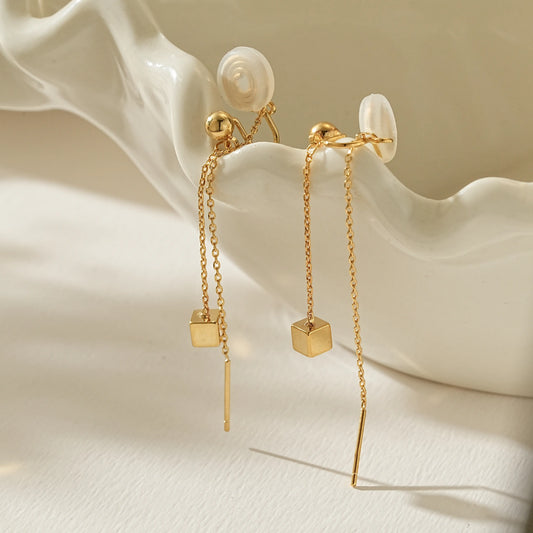 Close-up of 18k gold plated threader clip-ons for unpierced ears, showing the chain detail.