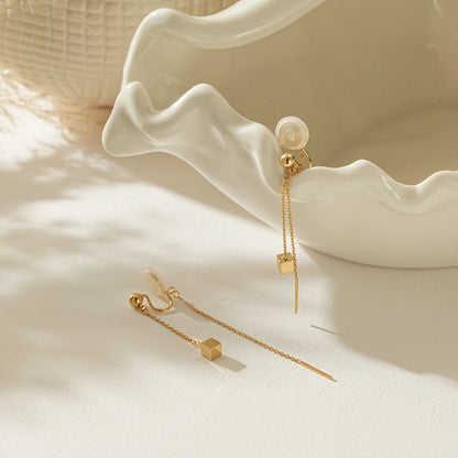 Gold linear threader illusion clip-on earrings with a long delicate cable chain.