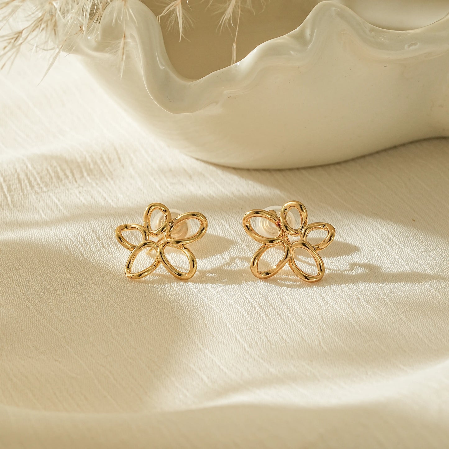 18k gold plated twisted wire flower clip-on earrings, open-work floral design.
