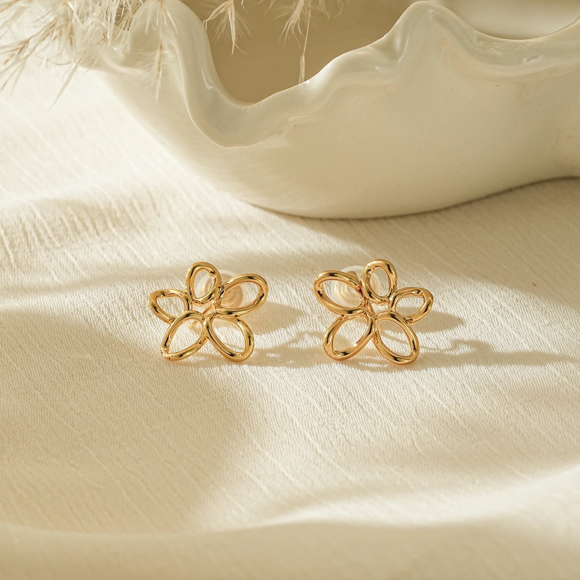 18k gold plated twisted wire flower clip-on earrings, open-work floral design.
