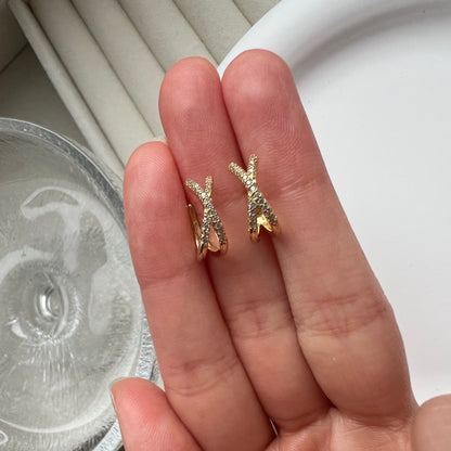 Close-up of a gold ear cuff showing the smooth, rounded edges designed for a comfortable, adjustable fit