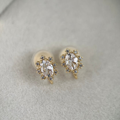 Close up front view of oval cubic zirconia crystal clip-on stud earrings with prong setting.