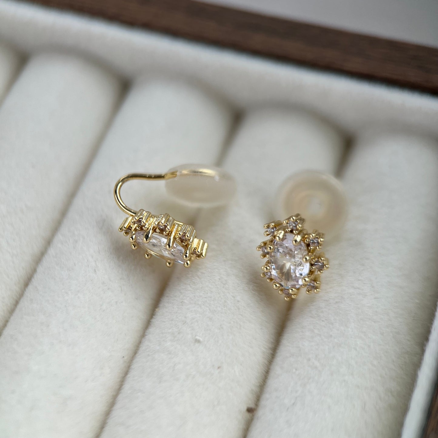 Side view of clip-on earrings showing clear resin invisible clip backing for sensitive ears.