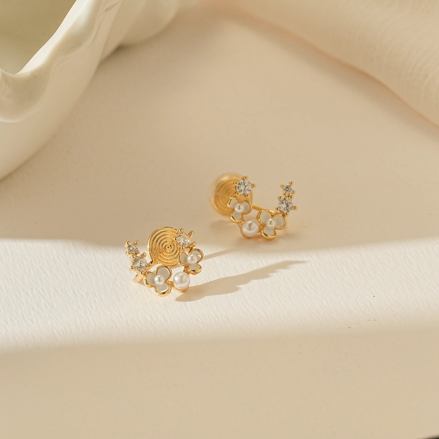 Tiny pearl floral stud clip-on earrings in 18k gold plating.