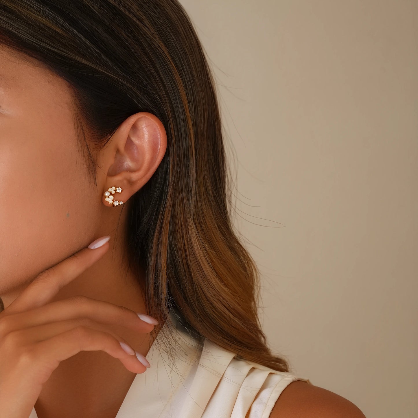 Model wearing petite pearl flora studs for a clean, everyday minimalist look.