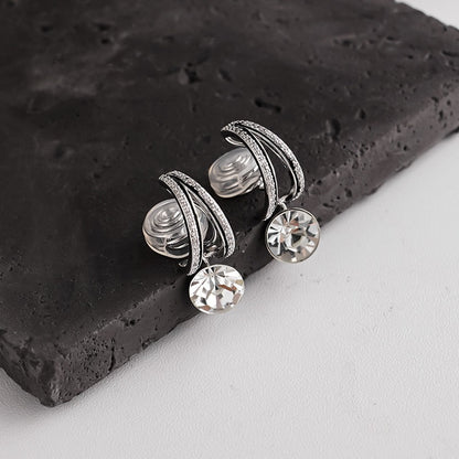 Detailed close-up showing the clear silicone cushion backing on a silver pave drop clip-on earring for comfortable wear.
