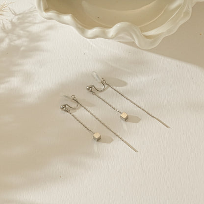Side view of silver long chain clip-ons illustrating the lightweight, pinch-free fit.
