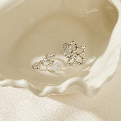 Side view of silver wire flower clips showing the lightweight and secure clip mechanism.