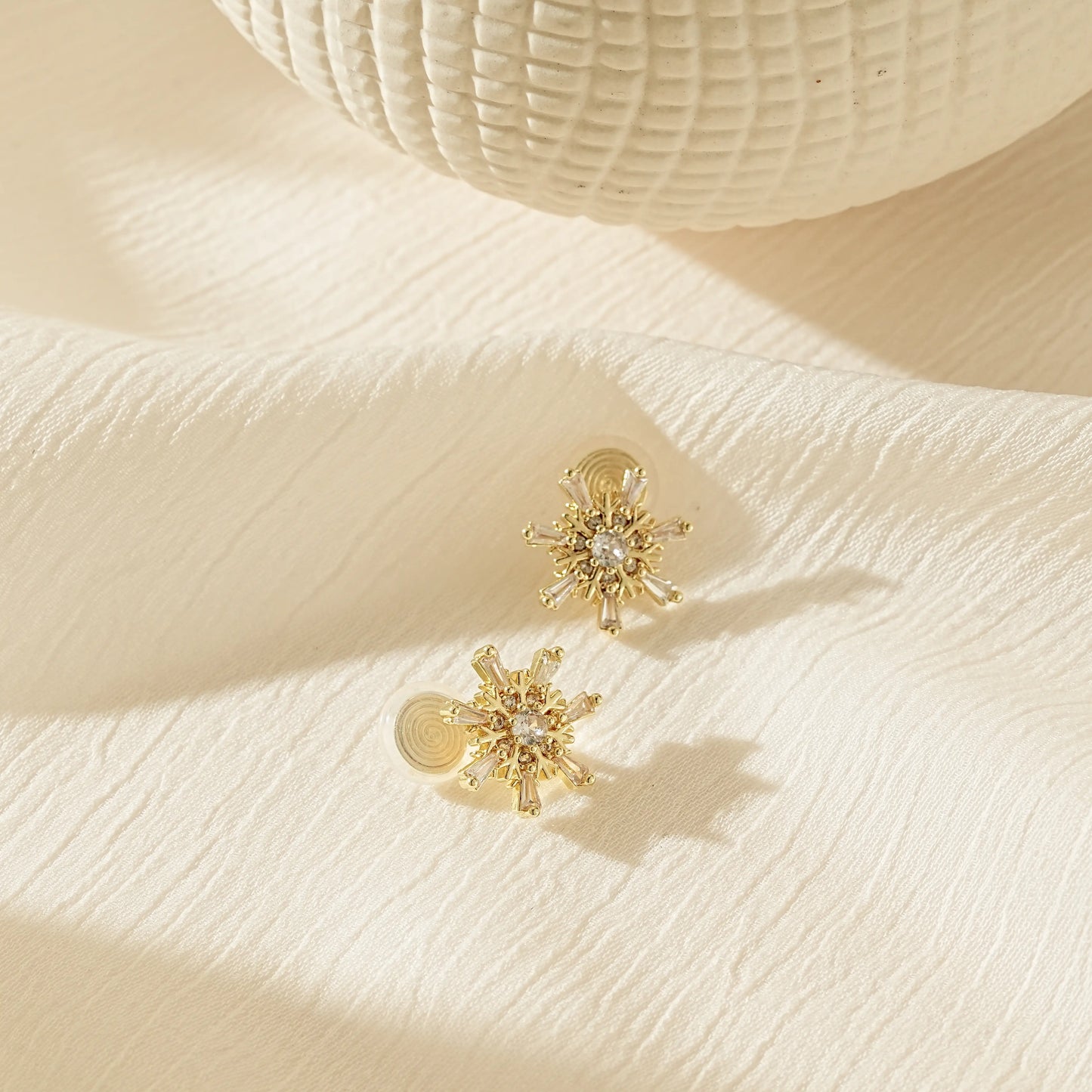 Side view showing the adjustable, pinch-free clip-on back for stud earrings.