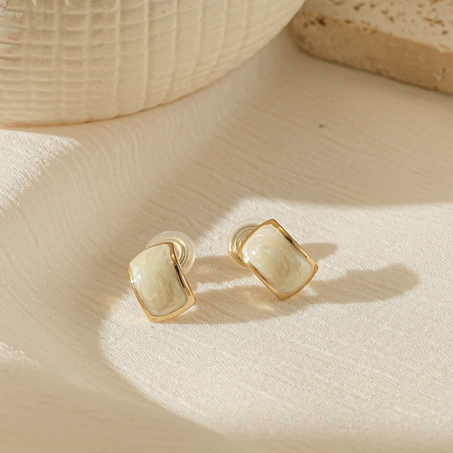 Handmade white enamel dripping oil clip-on earrings in 18k gold plating.