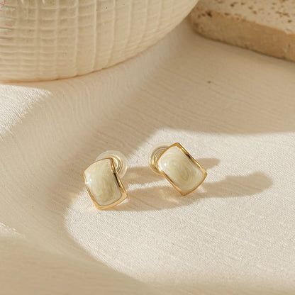 Handmade white enamel dripping oil clip-on earrings in 18k gold plating.