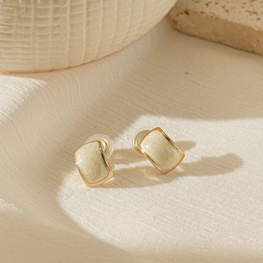 Handmade white enamel dripping oil clip-on earrings in 18k gold plating.