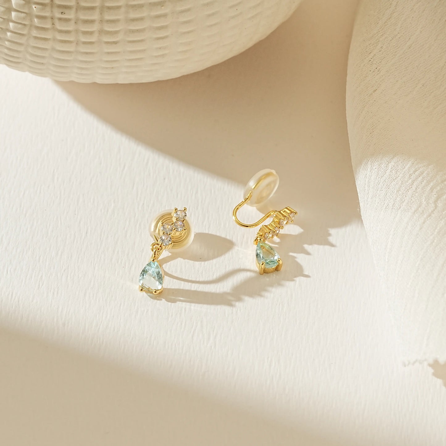 Rear view of Earclipse Boutique blue drop earrings showcasing the adjustable, comfortable clip-on mechanism for unpierced ears.